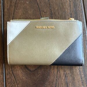 Michael Kors large wallet. Great condition. Black, white and green